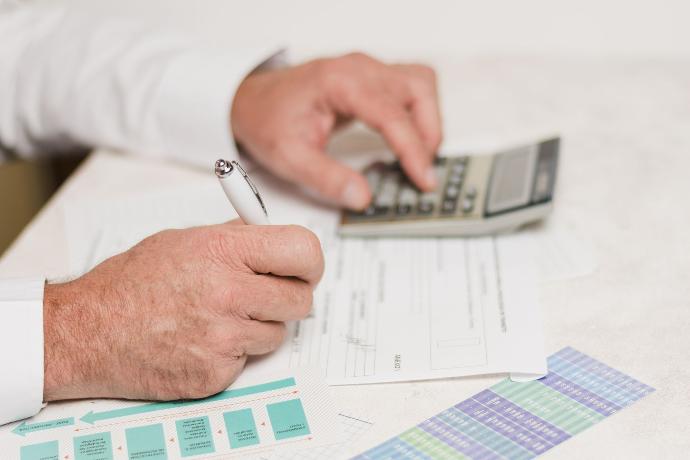 Businessman using calculator